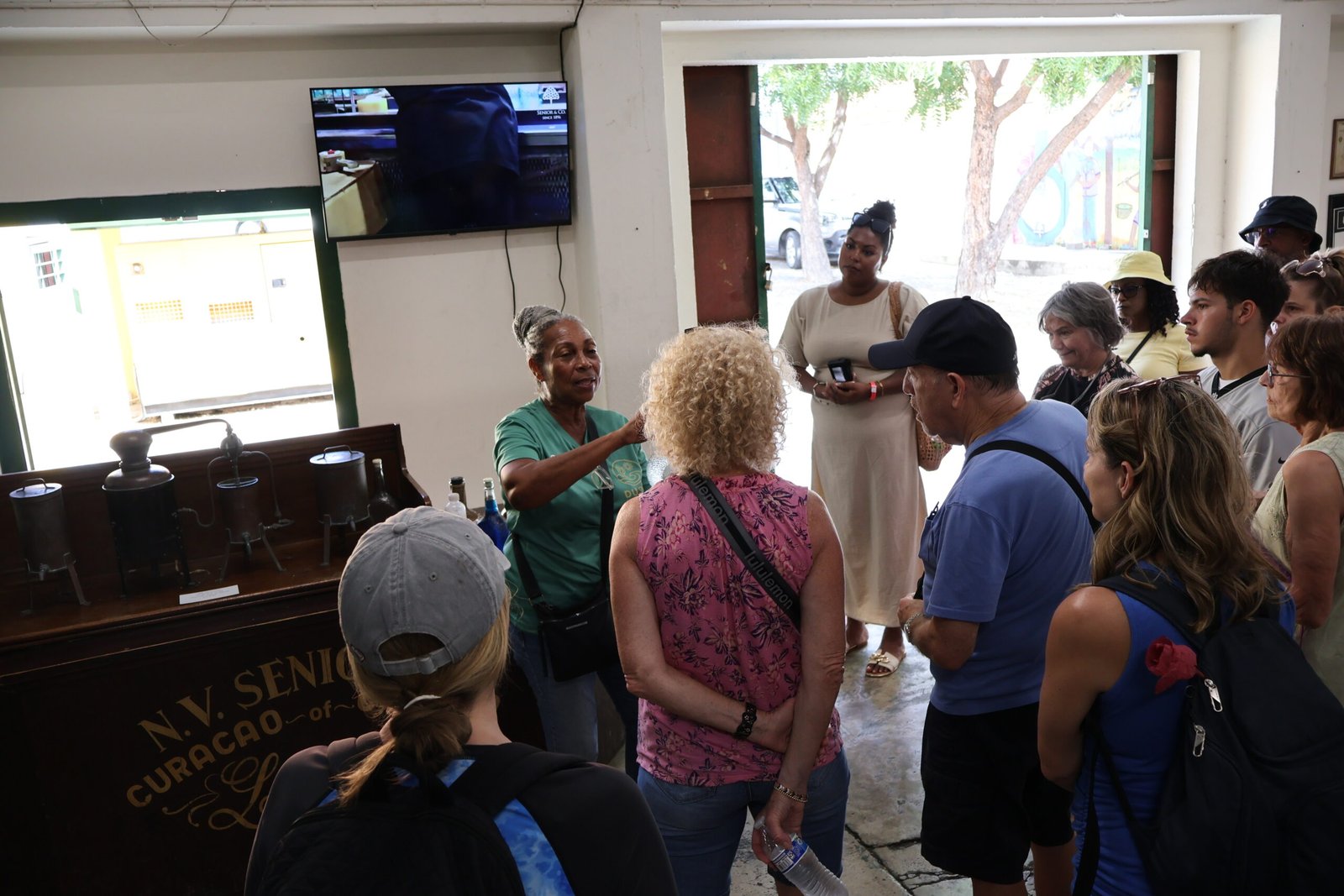 Tour group at Landhuis Chobolobo Blue Curaçao distillery