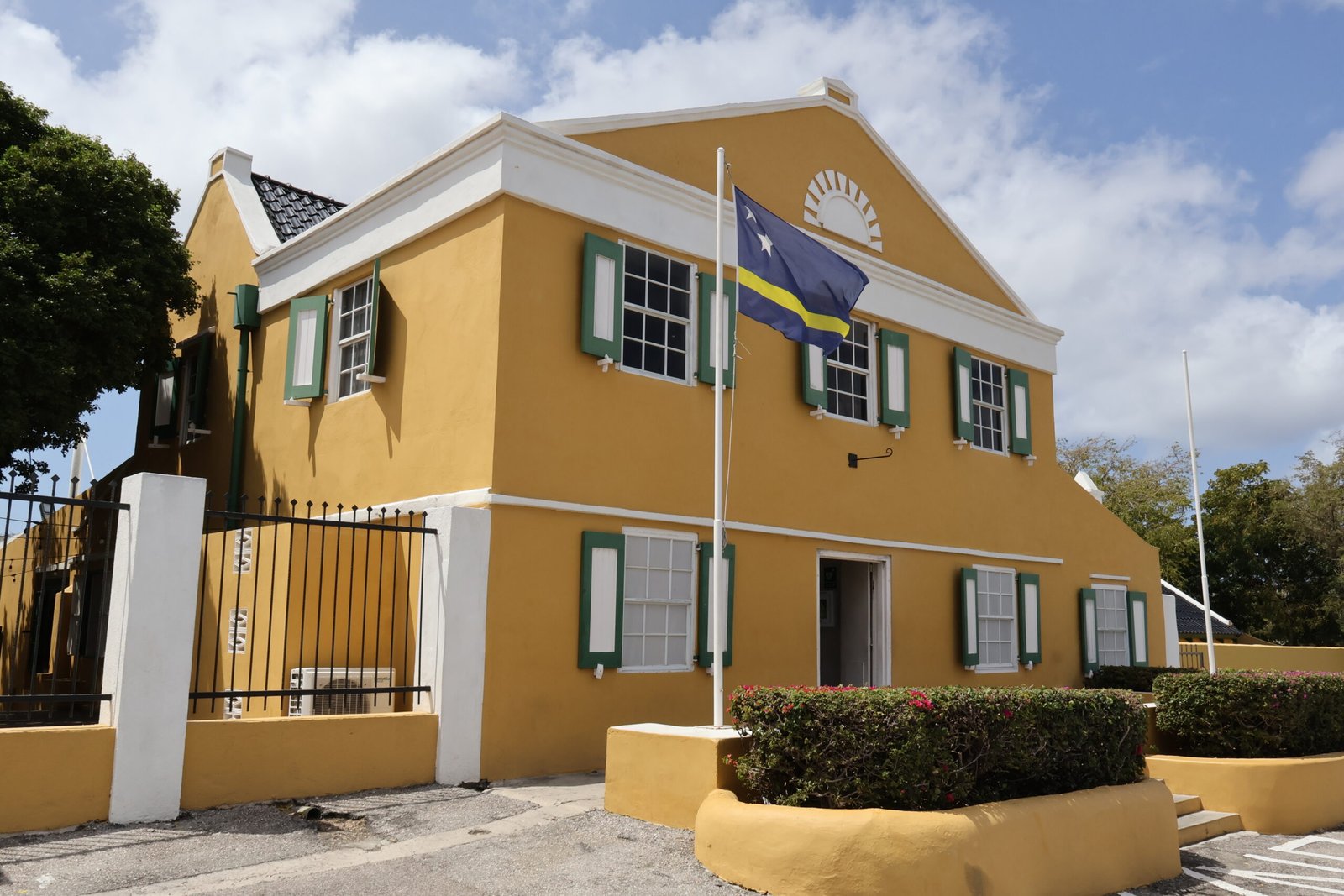 Yellow building with Curaçao flag in Willemstad